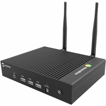 Black computer router with antennas on a white background