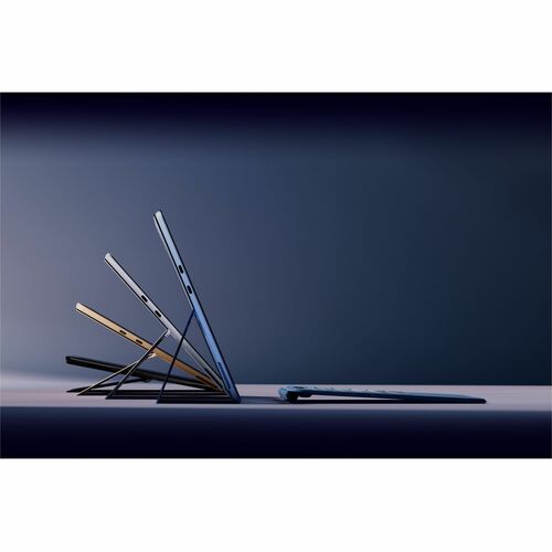 Multiple laptop computers stacked and arranged in a visually appealing manner on a dark background