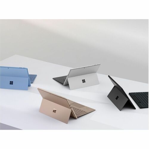 Multiple Surface devices on a white surface with a light gray background