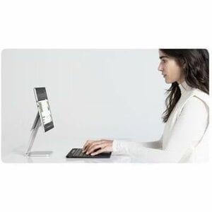 Woman using a computer with a minimalist design on a white background