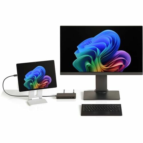 Two computer monitors with colorful displays, a keyboard, and a router on a white background.