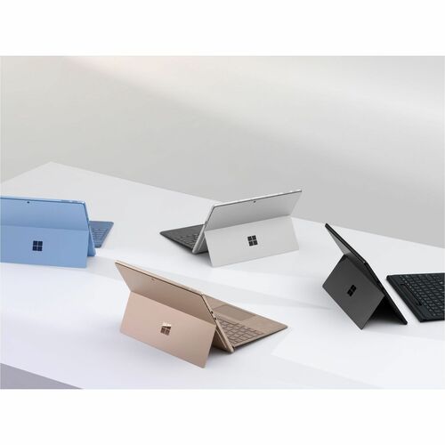multiple microsoft surface tablets of different colors: black, silver, rose gold and blue