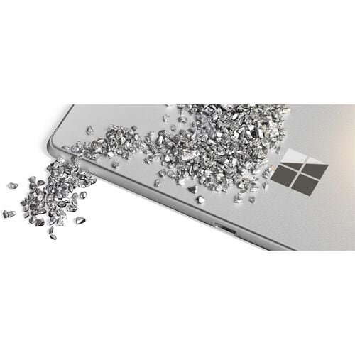 Silver laptop with a pile of diamonds on a white background