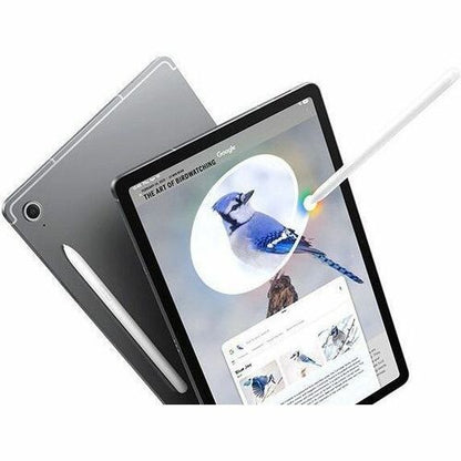 Tablet with stylus on screen displaying birdwatching app, surrounded by additional tablets.