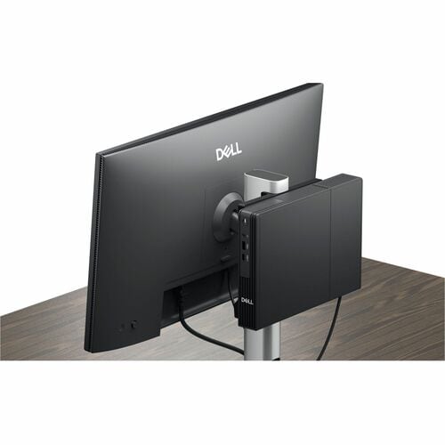 Dell computer monitor with stand on a wooden surface