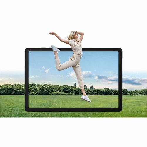 Woman in a white outfit posing on a grassy field with a tablet displaying the same scene.
